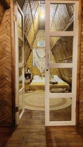 an open door to a bedroom with a bed in a room at Urban Oasis Resort, Tarlac in Tarlac