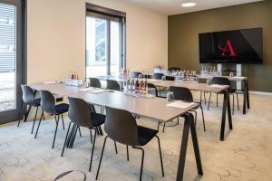 TV a/nebo společenská místnost v ubytování Abasto Hotel Dachau