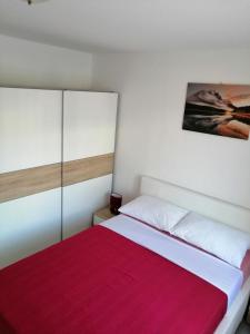 Posteľ alebo postele v izbe v ubytovaní Apartmani Grabovčić