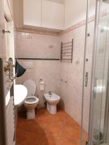 a bathroom with a toilet and a sink at PERLA DEL GOLFO (con Box Auto) in Lerici +36 photos