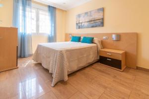 A bed or beds in a room at Casa Adrimar