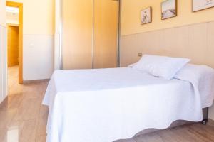 A bed or beds in a room at Casa Adrimar