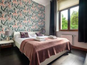 Posteľ alebo postele v izbe v ubytovaní CracWoW VIP Apartment