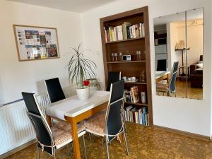 a dining room with a table and chairs at Apartmán Na Rozcestí Třeboň in Třeboň