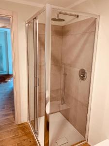 a shower with a glass door in a bathroom at Lo Micho - Le Four des Alpes in Rhemes-Saint-Georges