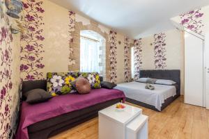 a living room with a couch and a bed at Apartments Johnny Split Croatia with Hot Tub in Split +111 photos