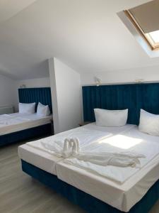 Postel nebo postele na pokoji v ubytování ADMAR Rooms & Restaurant