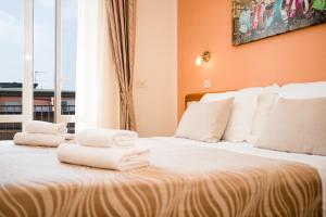 Postel nebo postele na pokoji v ubytování Unique Hotel