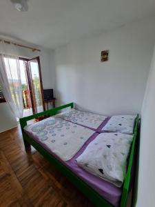 Postel nebo postele na pokoji v ubytování Apartman Mataija