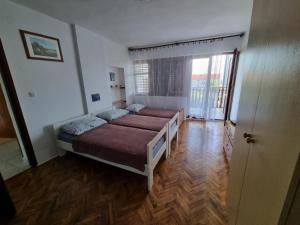 Postel nebo postele na pokoji v ubytování Apartman Mataija