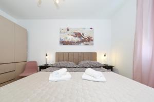 Posteľ alebo postele v izbe v ubytovaní Apartman Maresa