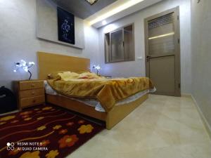 Voodi või voodid majutusasutuse Appartement à Bouznika prêt du plage Dahomey, plage bouznika, Bahia beach toas
