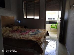 Voodi või voodid majutusasutuse Appartement à Bouznika prêt du plage Dahomey, plage bouznika, Bahia beach toas