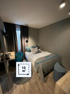 Voodi või voodid majutusasutuse Hotel Falkenturm toas