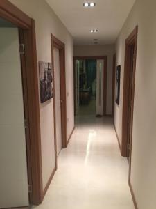 a corridor of a room with doors and a hallwayngth at Residence Gurpinar Grand Luxe Beach + Wifi + parking privé in Istanbul