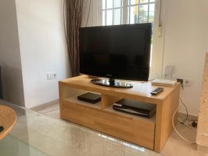 A television and/or entertainment centre at 3 Storey Townhouse - Costa Del Sol