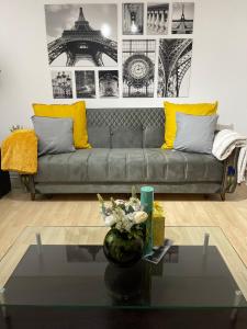 a living room with a couch and a table at NewSuites in London