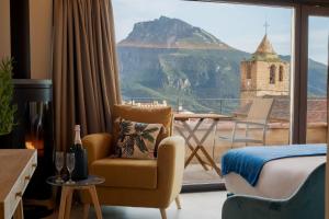 a hotel room with a view of a mountain at Hotel Poeta Jorge Manrique in Segura de la Sierra