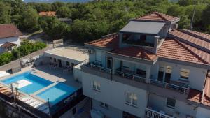 an aerial view of a house with a swimming pool at Adria centar Koćuša in Ljubuški