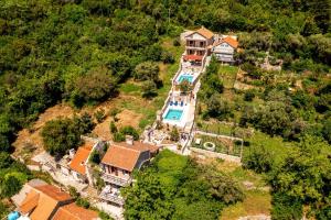 an aerial view of a house with a swimming pool at Old Stone House Villas in Tivat