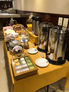 a table with a counter top with two blender at Bristol Hotel in Buenos Aires