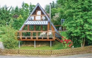 a tree house with a porch and a deck at 1 Bedroom Amazing Home In Wolfshagen in Wolfshagen