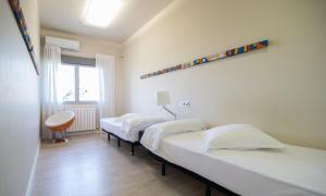 Rúm í herbergi á RuralSuite Hotel Apartamentos