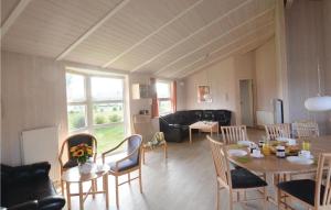 a living room with a table and chairs at Strandblick 21 - Dorf 1 in Travemünde