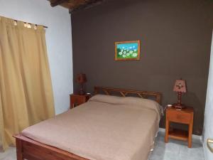 A bed or beds in a room at Cabañas DAYMA