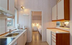 a kitchen with a sink and a counter top at Friedrichskoog-Strandpark 11 in Friedrichskoog