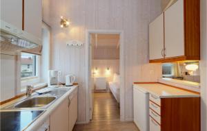 a kitchen with a sink and a counter top at Friedrichskoog-Strandpark 22 in Friedrichskoog