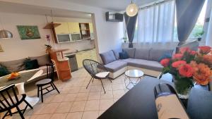 a living room with a couch and a table at Apartment Diocletian in Split