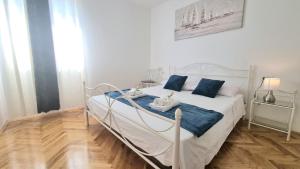 Posteľ alebo postele v izbe v ubytovaní Apartment Diocletian