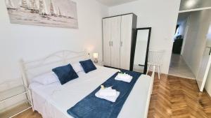 Posteľ alebo postele v izbe v ubytovaní Apartment Diocletian