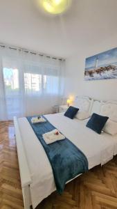 Posteľ alebo postele v izbe v ubytovaní Apartment Diocletian