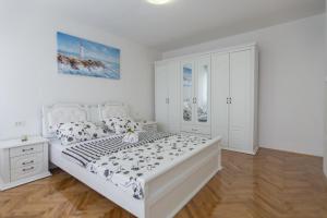 Posteľ alebo postele v izbe v ubytovaní Apartment Diocletian