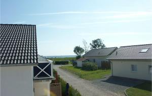 a view of a street with two houses at Haus Seeadler 1 in Süssau +15 photos