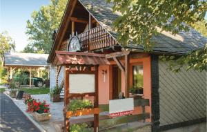 a small house with a sign in front of it at Gorgeous Home In Gleima With Kitchen in Gleima