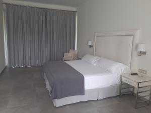Postel nebo postele na pokoji v ubytování Hotel Atlántico