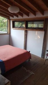 A bed or beds in a room at Cabaña Lodge los Coihues VALLE LAS TRANCAS# TERMAS DE CHILLAN#NEVADOS DE CHILLAN