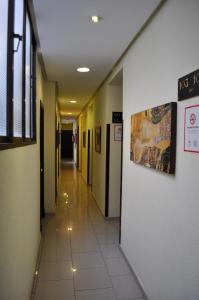 an empty hallway in a hospital with a hallway at Hotel Roma in San Fernando