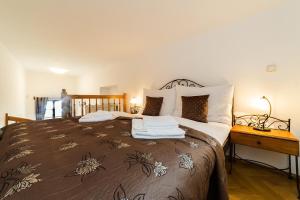 Posteľ alebo postele v izbe v ubytovaní Vila Krumlov