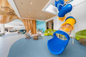 a childrens play room with a slide at Solea Coast Resort Panglao in Panglao Island
