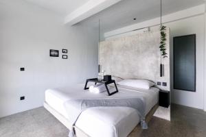 Postel nebo postele na pokoji v ubytování OCEANNA - Uluwatu, Bali