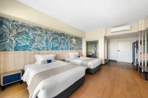 Katil atau katil-katil dalam bilik di Solea Coast Resort Panglao