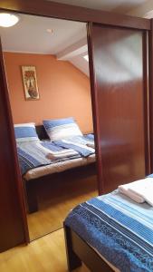 Postel nebo postele na pokoji v ubytování Apartmány Prima