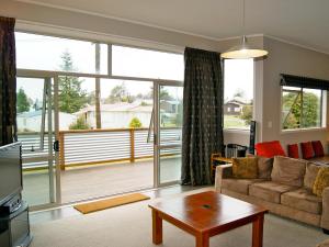 a living room with a couch and a table at 45 Below - National Park Holiday Home in National Park