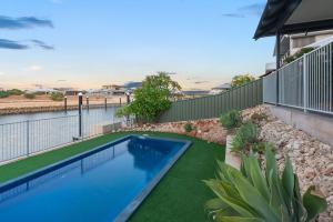 a swimming pool in the backyard of a house at 3 Kestrel Place in Exmouth