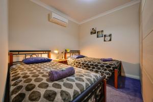Ένα ή περισσότερα κρεβάτια σε δωμάτιο στο 16 Crevalle Way