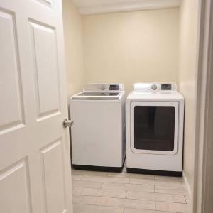 a kitchen with a stove and a white oven at Entire Cozy Basement! Private Entrance! - Fast Wifi! in Salt Lake City